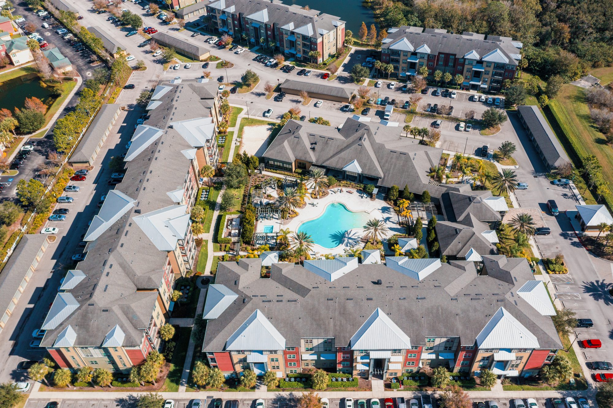 Aerial view of a multifamily community under a Bradenton sunset