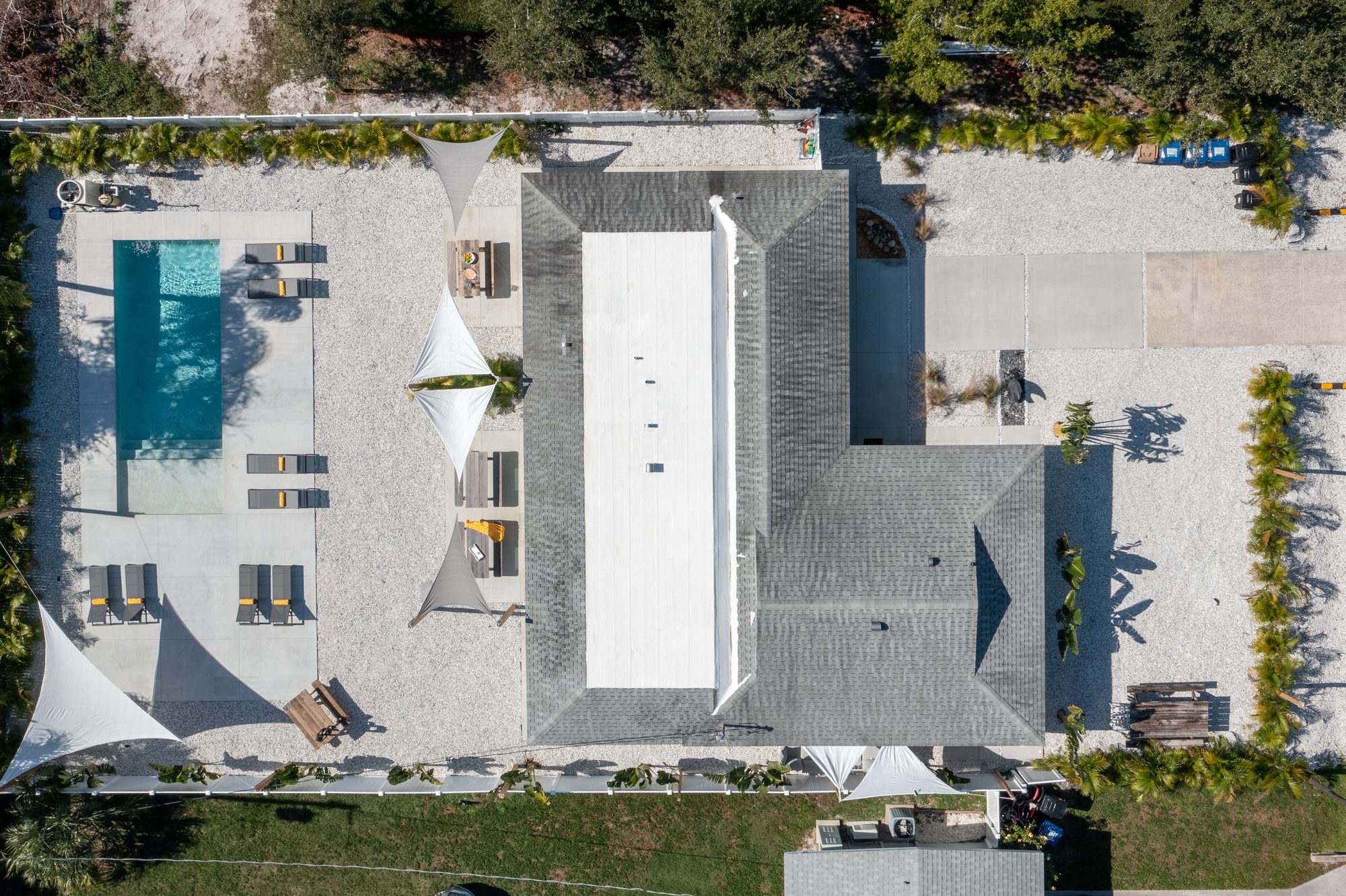 Top-down drone view of a Sarasota home, pool, and lot